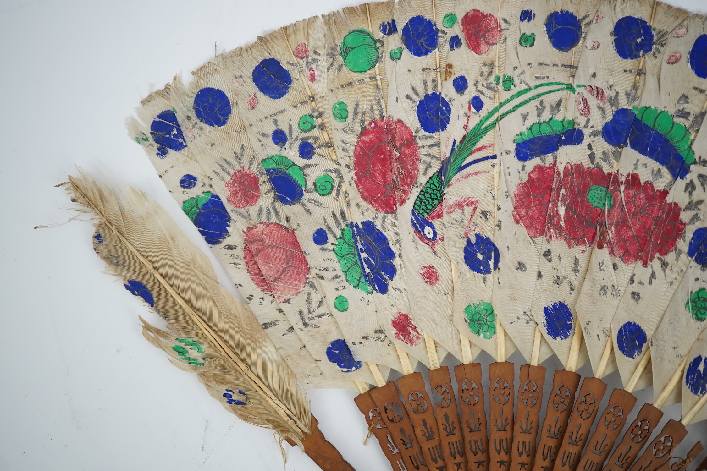 Three 19th century Chinese feather fans: One a carved bone brise black feather fan together with two similar carved sandalwood feather fans, two fans have hand painted decoration on the feathers both sides, the pink feat